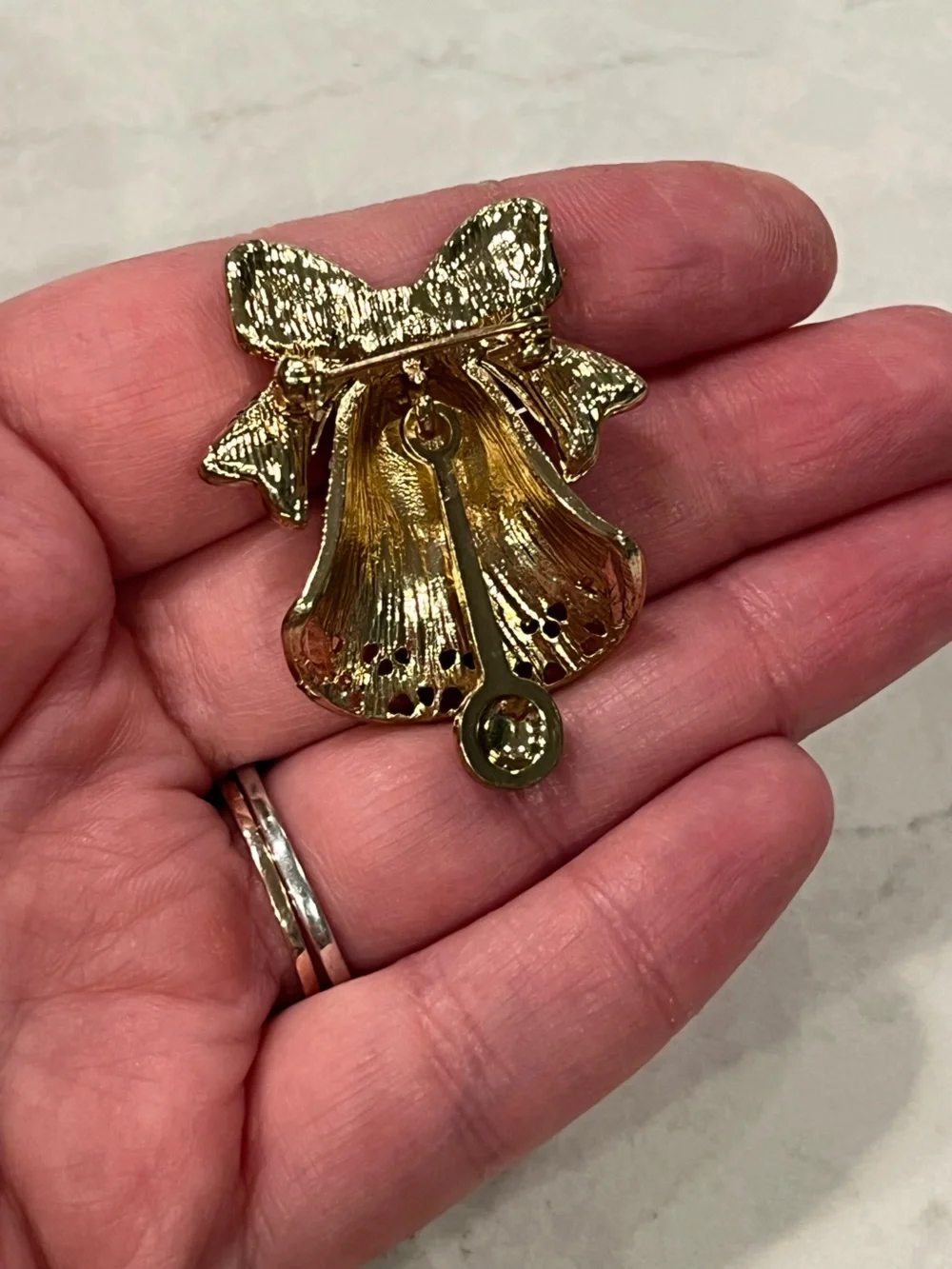 Vintage Gold-Tone bell brooch with moving ball at bottom